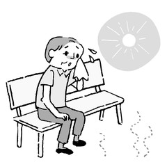 A man sitting on a bench in the summer