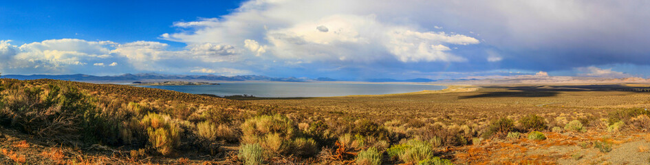 Mono lake during sunset with dramatic clouds, panorama