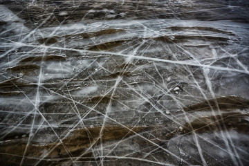 cracked ice texture, abstract seasonal winter cold background, natural ice, broken ice on a lake