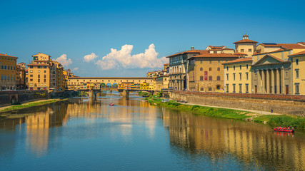 Fototapeta na wymiar Beautiful wide angle view on Ponte del Vecchio and Arno river in Florence, Italy at summer's noon