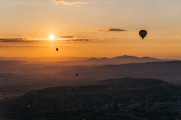 The view from above hot air balloon at sunrise at Cappadocia valley.