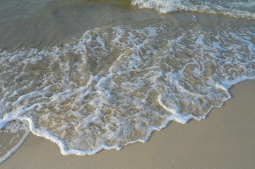 Top View on waves on beach aerial view, crystal clear water with beautiful foam