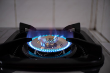 Burning blue flames from a kitchen gas stove