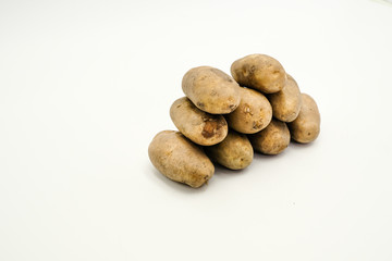 Potatoes or Solanum tuberosum, shots on isolated white background.