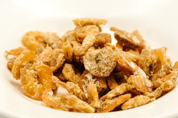 Dried shrimps, am East Asian cuisines, shots on isolated white background.
