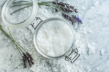 Jar of Bath Salts with Lavendar on White Marble From Overhead