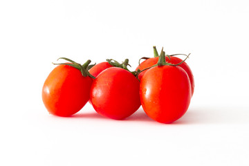 Red cherry tomatoes isolated on white