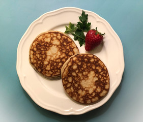 Sweet pancakes with fresh strawberry. Breakfast concept.