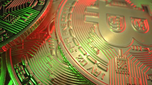 Crypto currency, bitcoin. BTC, Bit Coin. Blockchain technology, bitcoin mining. Macro shot of rotating bitcoins. Halving. Gold coins. World currency. Laowa macro lens
