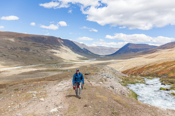 Fototapeta premium Tourist climbs uphill. The nature of Mongolia