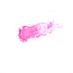 Pink crushed eye shadow isolated on white background. Splatter make up and cosmetic products.