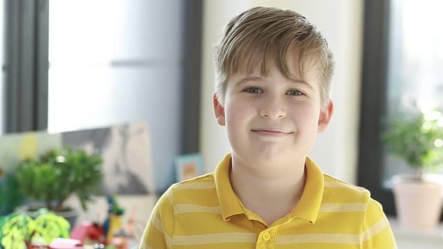 Portrait of a happy smiling boy.   Cheerful boy. Funny boy looking at the camera.
