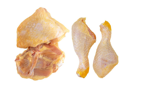 Raw chicken legs and thighs isolated on white