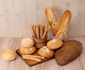 Сrisp bread with buns. French baguettes. Fresh crispbread. Bread background. Different breed  on...