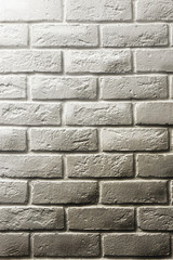 White brick wall, shadow and gradients, volume, from white to gray. Texture background for design and layouts