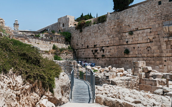the southern section of the kotel western wall of the second temple showing people praying in the egalitarian section among the rubble from the roman destruction of jerusalem