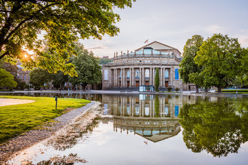 Reflections of Stuttgart "Opernhaus", colorful trees on a warm spring morning