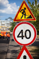 Road work and speed limit signs.