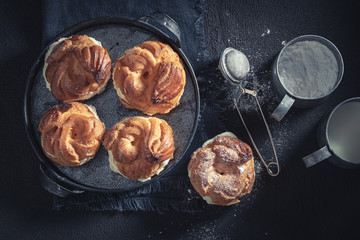Top view of cream puffs with powdered sugar