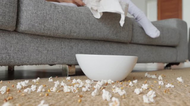 Popcorn plate falling on a floor in slow motion