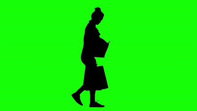 Woman Talking on The Phone Holding Shopping Bags Green Screen Silhouette