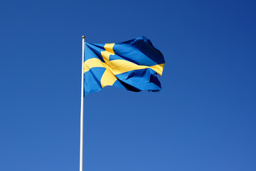 Sweden flag waving against the clear blue sky
