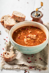 Hot tripe soup made of vegetables and red peppers