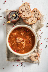 Spicy tripe soup served with whole grain bread