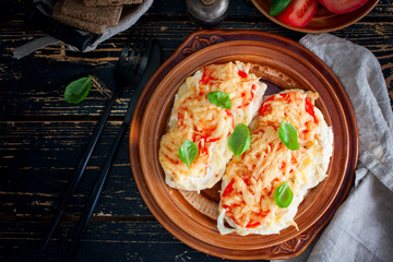 chops with chicken breast, tomatoes, onions and cheese, selective focus