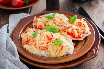 chops with chicken breast, tomatoes, onions and cheese, selective focus