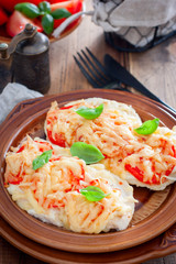 chops with chicken breast, tomatoes, onions and cheese, selective focus