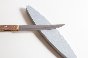 Kitchen knife with wooden handle and whetstone