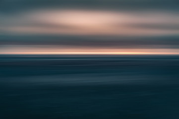 Dramatic long exposure of a dark sunset over the sea