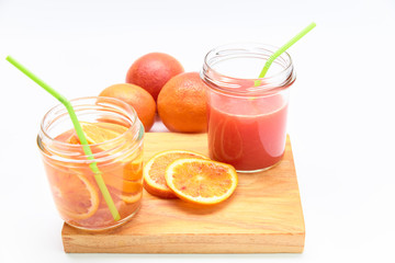 Jars of orangeade and homemade red orange juice