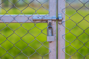 The keys at the outdoor sports gate lock.