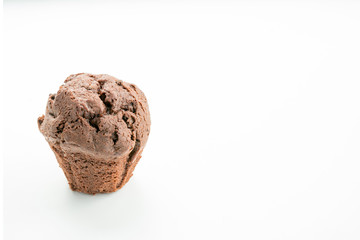 chocolate muffin on a white background. concept of using space for a recipe