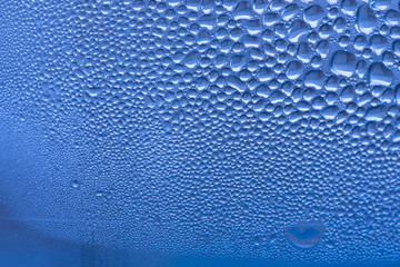 Blue water drops macro detail or close-up background