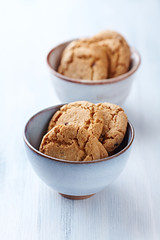  Butter cookies on bright wooden background.