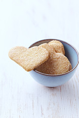 Butter cookies on bright wooden background. Copy space.