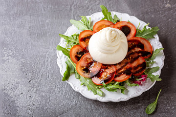 Fresh Italian cheese made from cow's milk - burrata. Top view. The empty space on the left