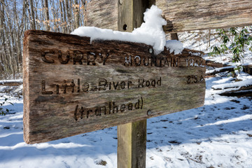 Curry Mountain Trail sign with snow coating