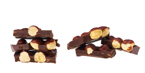 Hazelnut  and dark chocolate pieces tower isolated on white background.