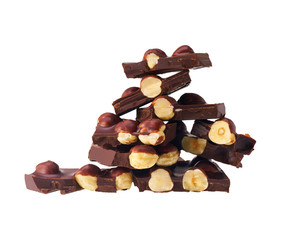 Hazelnut  and dark chocolate pieces tower isolated on white background.