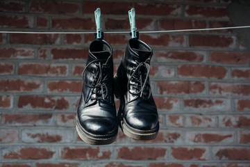 black boots on the brick background 