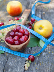 Summer fruit and tape measure.