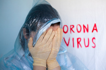 Woman in a protective suit closing her face.