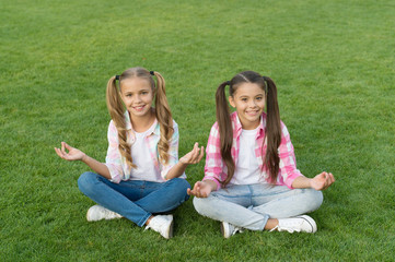 Stay optimistic. Sisterhood and friendship. Cheerful schoolgirls on sunny day. Girl ponytails hairstyle enjoy relax. Living happy life. Happy smiling friends. Have fun. Happy kids relaxing outdoors