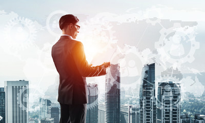 Concept of business success and control with confident boss against cityscape background