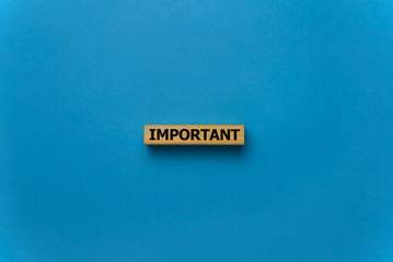 important word written on wood block. important text on wooden table for your desing, concept