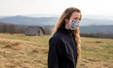 Virus mask young woman wearing face protection in prevention for coronavirus while walk